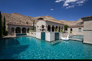 Bright blue water's give this hillside landscape a inviting look. Using bright colored finishes, like StoneScapes Irish Mist, can make any landscape feel inviting.