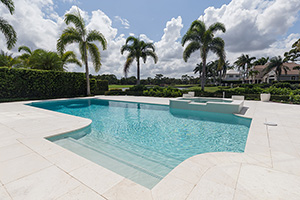 If you're after the Santorini look, all-white natural stone and light pool finishes are key. Step in, relax, and enjoy the backyard escape.