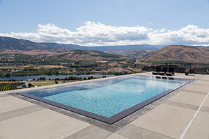 Perimeter overflow pools allow the water to flow over edges into a hidden catch basin from which it flows back into the pool. This results in the "sheet of glass" surface look.