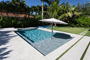 What's your favorite water color? Bright like the tropics or deep blue like the sea? This light colored pool brings out the relaxation mindset in any soul.