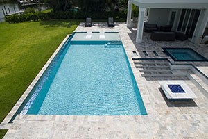 Is there a better place to spend the weekend than lounging poolside? What about a pool with an infinity edge opening up to a riverside view? This glamorous geometric poolscape has it all. Kick back on the lounge chairs, gather in the conversation pit or soak in the hot tub.