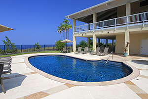 The selection of NPT QuartzScapes Midnight Blue pool finish proved the perfect match to surf and sky for this Hawaiian condominium. The backyard beauty serves as a constant and refreshing reminder for residents of the luxurious island life that surrounds them.