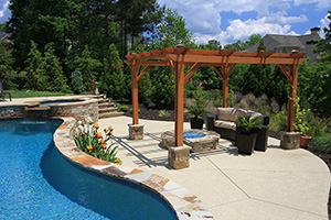 When cold weather puts your pool time on hold, you can still appreciate its beauty from a comfortable spot around a chill-chasing fire pit.