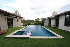 Surrounding your pool with grass gives your design a contemporary Zen look. An infinity edge opens up to a verdant landscape, enhancing the connection to nature.