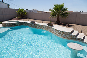 The fun doesn't stop in this crystal-clear Arizona poolscape. Kick your feet up and catch some rays on the tanning ledge. Relax and relieve stress in the hot tub. Or, swim to your heart's content, enjoying the peaceful sounds of falling water.