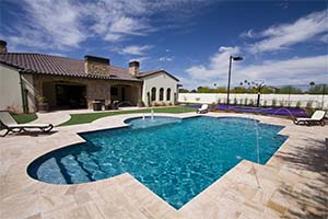 After playing basketball on the full-size basketball court, these homeowners enjoy their grecian pool, sun shelf with bubblers, decks jets, and more. What a life!